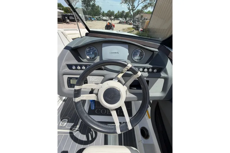 Slide: The Image of Steering wheel and dashboard of a 2013 Cobalt R5 boat with Garmin display. - 6
