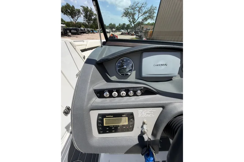 Slide: The Image of Dashboard of a 2013 Cobalt R5 boat featuring Garmin navigation system. - 7