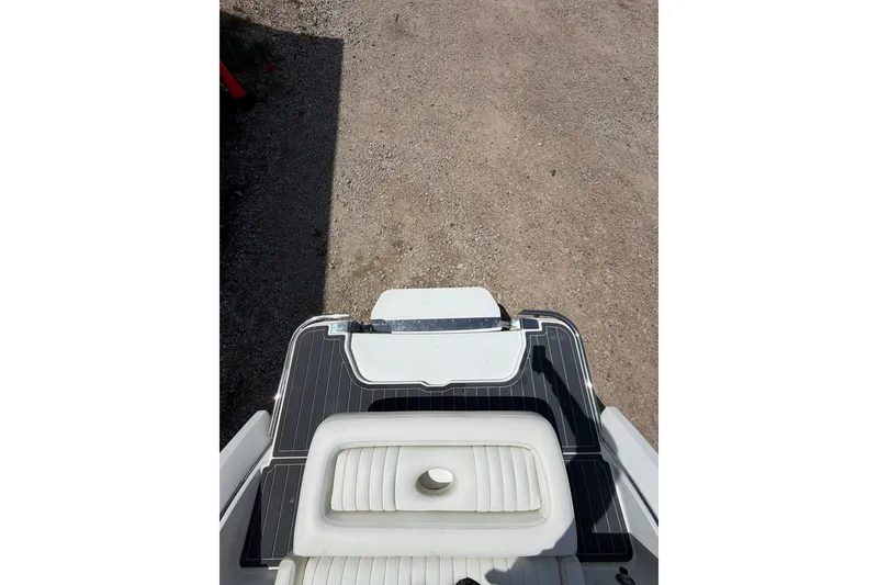 Slide: The Image of Rear view of a 2013 Cobalt R5 boat on a gravel surface. - 12