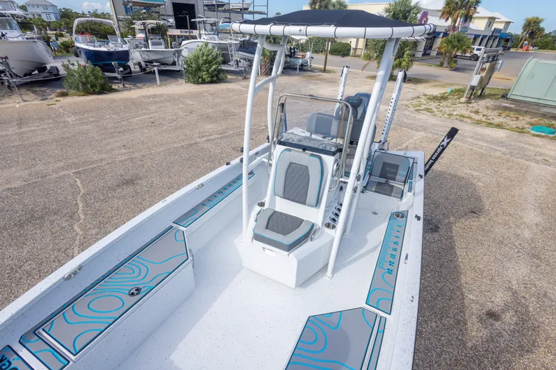 Slide: The Image of 2024 Xpress H22 Bay boat with sleek design and modern features, docked outdoors. - 34