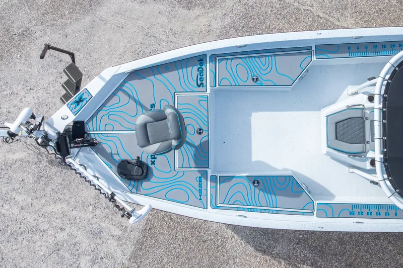 Slide: The Image of 2024 Xpress H22 Bay boat interior with seating and storage compartments, top view. - 13