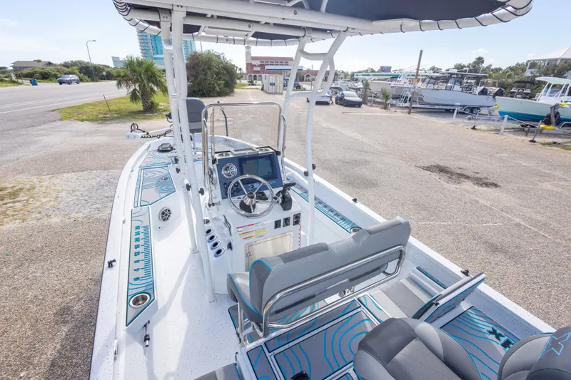 Slide: The Image of 2024 Xpress H22 Bay boat interior with modern console and seating. - 21
