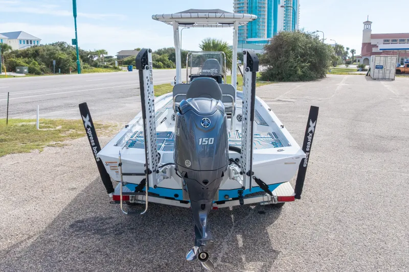 Slide: The Image of 2024 Xpress H22 Bay boat with Yamaha 150 engine on a trailer. - 54