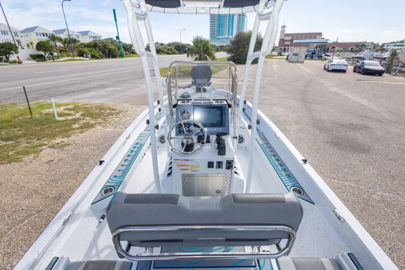 Slide: The Image of 2024 Xpress H22 Bay boat interior with modern dashboard and steering wheel. - 23