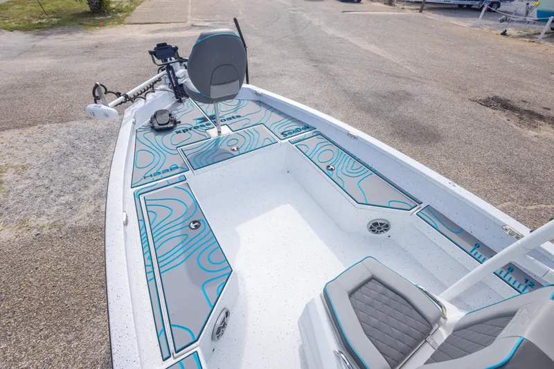Slide: The Image of 2024 Xpress H22 Bay boat interior with modern seating and fishing equipment. - 29
