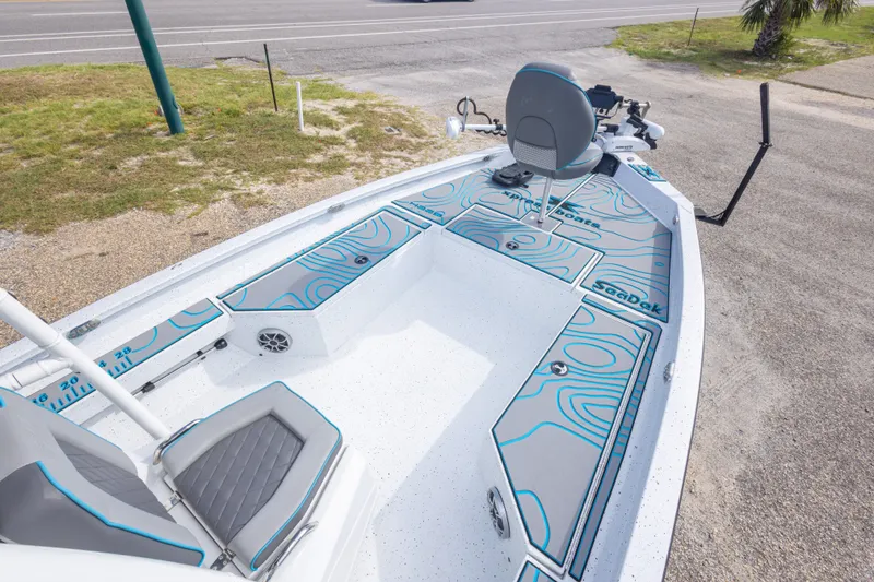 Slide: The Image of 2024 Xpress H22 Bay boat with SeaDek flooring, featuring a sleek design and comfortable seating. - 28