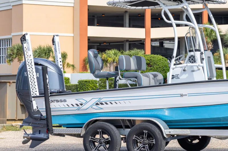 Slide: The Image of 2024 Xpress H22 Bay boat with Yamaha engine and Minn Kota accessories. - 10
