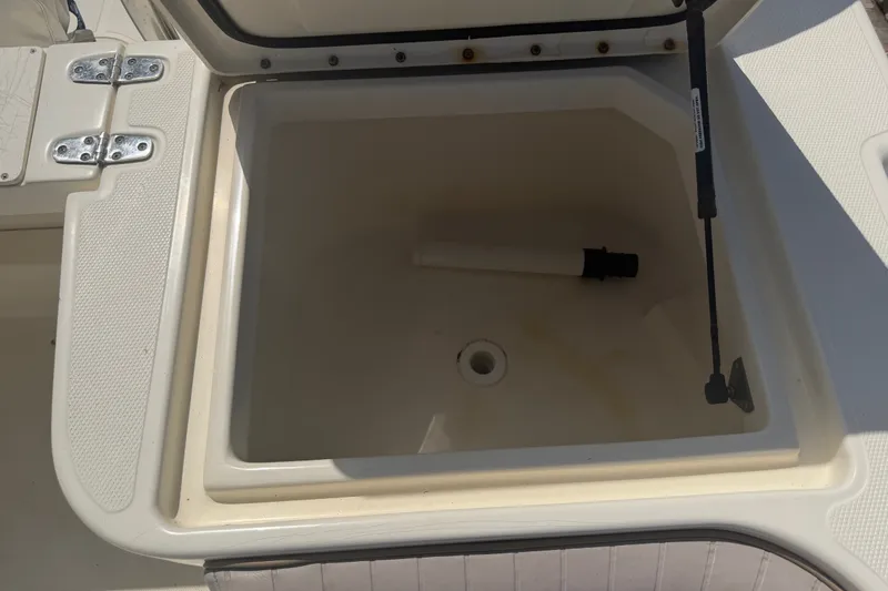Slide: The Image of Open storage compartment on 2006 World Cat 270 TE boat. - 44