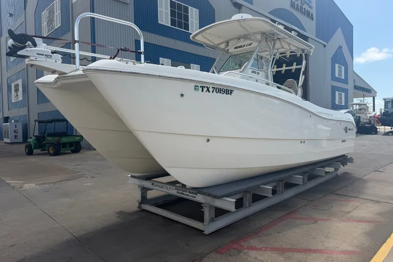 Slide: The Image of 2006 World Cat 270 TE boat on trailer at marina, side view. - 5