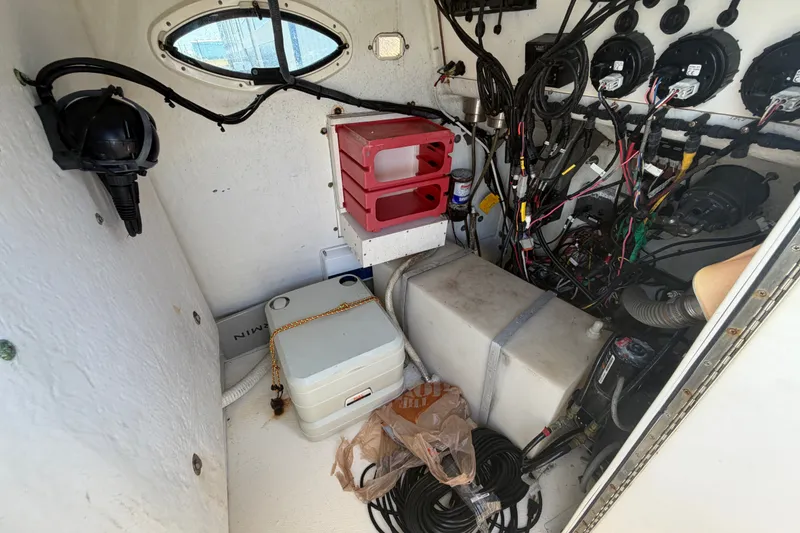 Slide: The Image of Interior of a 2006 World Cat 270 TE boat showing wiring and equipment. - 22