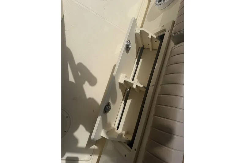 Slide: The Image of Open storage compartment on 2006 World Cat 270 TE boat interior. - 42
