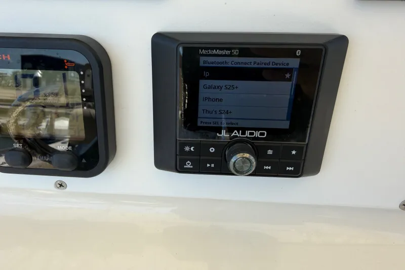 Slide: The Image of JL Audio MediaMaster 50 on 2006 World Cat 270 TE boat dashboard. - 35