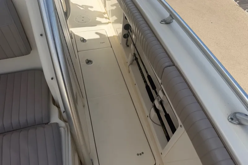 Slide: The Image of Interior view of a 2006 World Cat 270 TE boat, featuring seating and storage compartments. - 20