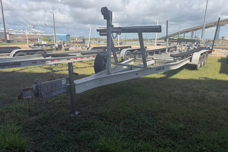 Slide: The Image of Boat trailer parked on grass, suitable for 2006 World Cat 270 TE model. - 55