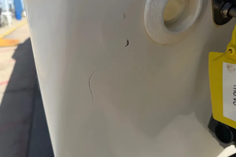 Slide: The Image of Close-up of a crack on a 2006 World Cat 270 TE boat hull. - 53