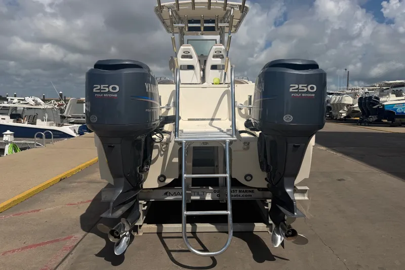 Slide: The Image of 2006 World Cat 270 TE boat with twin Yamaha 250 four-stroke engines at dock. - 8