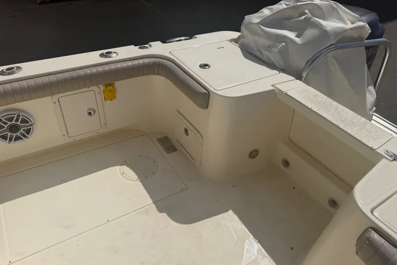 Slide: The Image of 2006 World Cat 270 TE boat interior with seating and storage compartments. - 10