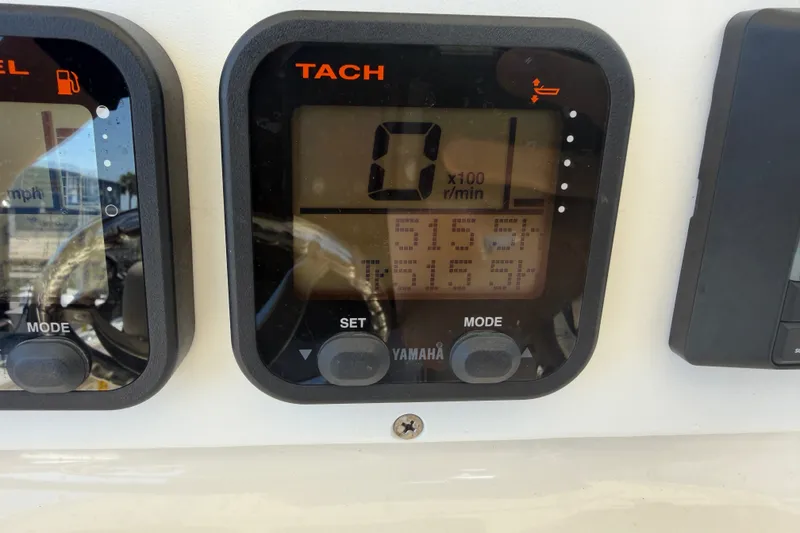 Slide: The Image of Yamaha tachometer display on 2006 World Cat 270 TE boat dashboard. - 32