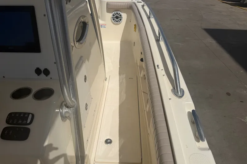 Slide: The Image of 2006 World Cat 270 TE boat interior with control panel and seating area. - 14