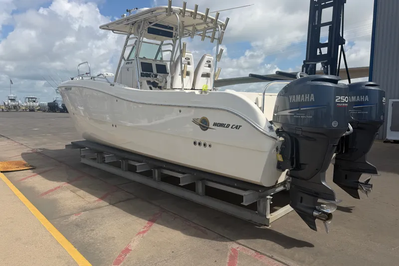 Slide: The Image of 2006 World Cat 270 TE boat with twin Yamaha 250 engines on a dock. - 9