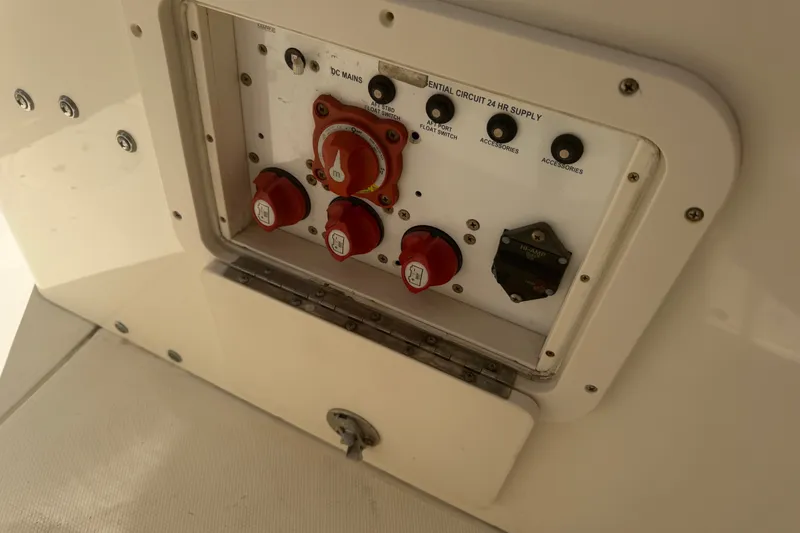Slide: The Image of Control panel of a 2006 World Cat 270 TE boat with switches and dials. - 30