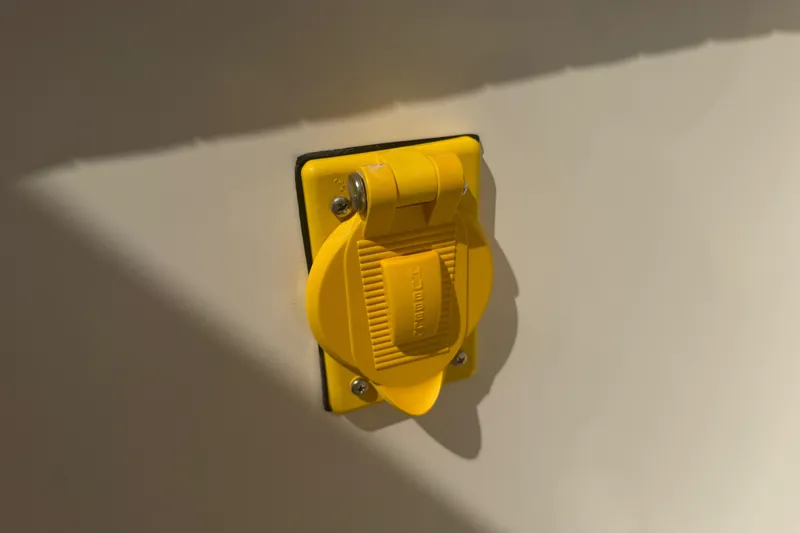 Slide: The Image of Yellow power outlet on 2006 World Cat 270 TE boat. - 47