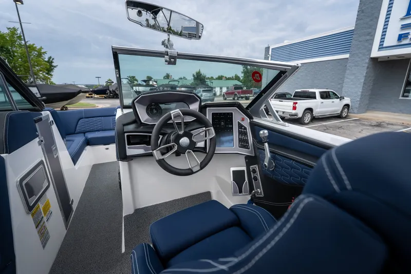 Slide: The Image of Interior view of 2021 MasterCraft X24 boat with modern steering and dashboard. - 27