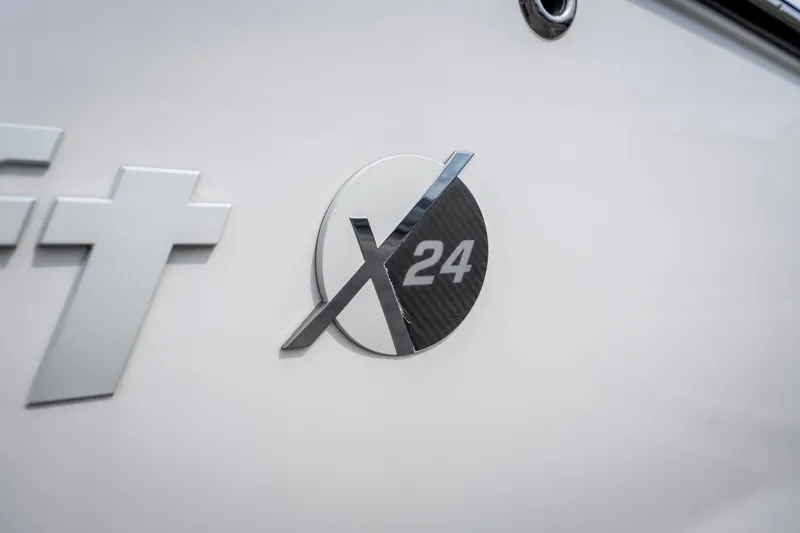 Slide: The Image of 2021 MasterCraft X24 logo on boat exterior, showcasing sleek design. - 18