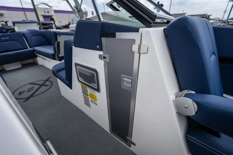Slide: The Image of Interior of 2021 MasterCraft X24 boat with blue seating and modern design. - 39