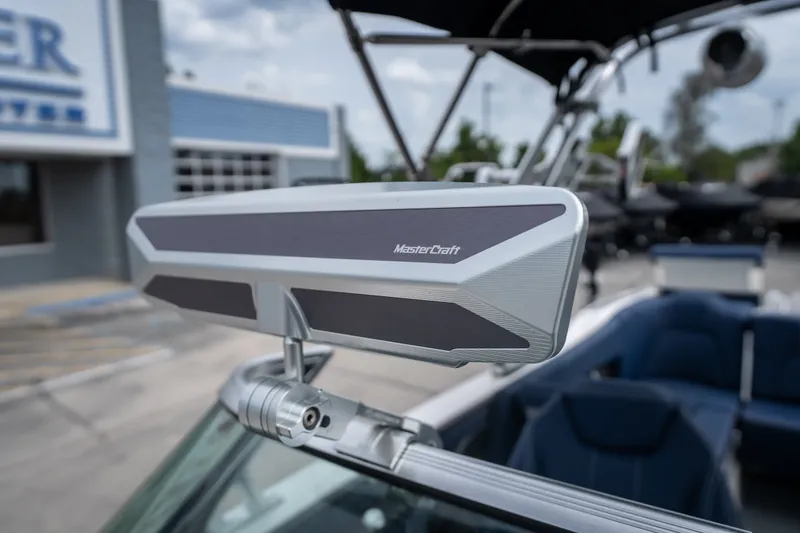 Slide: The Image of 2021 MasterCraft X24 boat rearview mirror, showcasing sleek design and branding. - 41