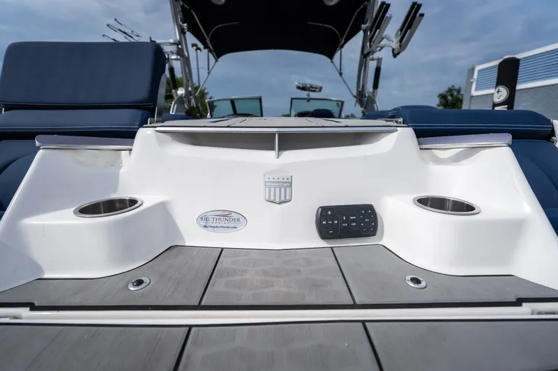 Slide: The Image of 2021 MasterCraft X24 boat interior with cup holders and control panel. - 21