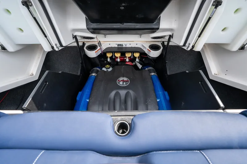 Slide: The Image of Engine compartment of a 2021 MasterCraft X24 boat, showcasing internal components. - 50
