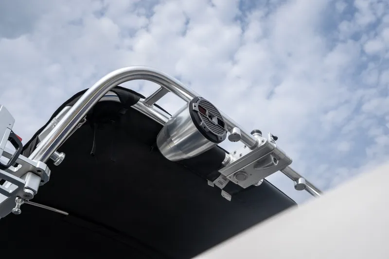 Slide: The Image of 2021 MasterCraft X24 boat tower with speaker against cloudy sky. - 20