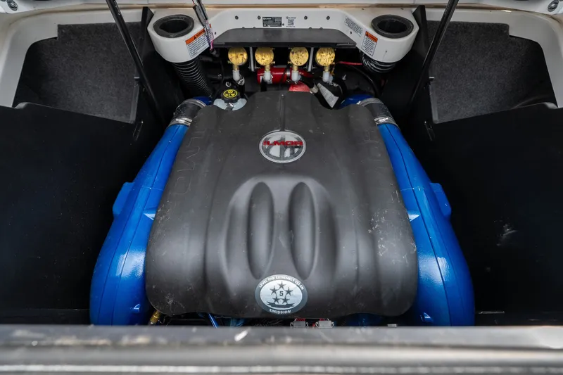 Slide: The Image of Engine compartment of a 2021 MasterCraft X24 boat, showcasing powerful components. - 51