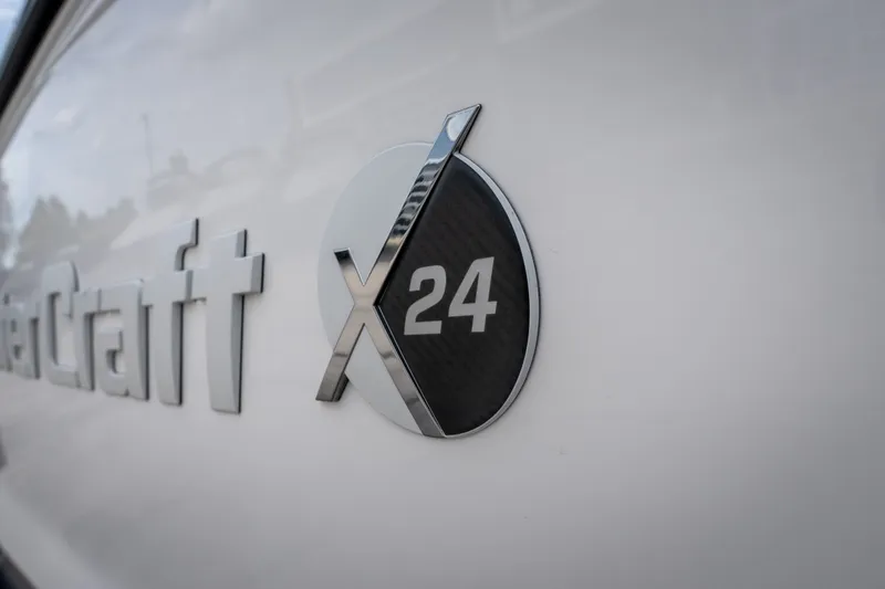 Slide: The Image of 2021 MasterCraft X24 logo on boat exterior, showcasing sleek design. - 14