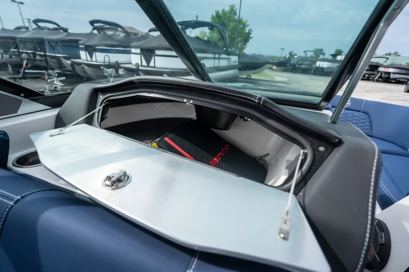 Slide: The Image of 2021 MasterCraft X24 boat interior storage compartment with open hatch. - 44