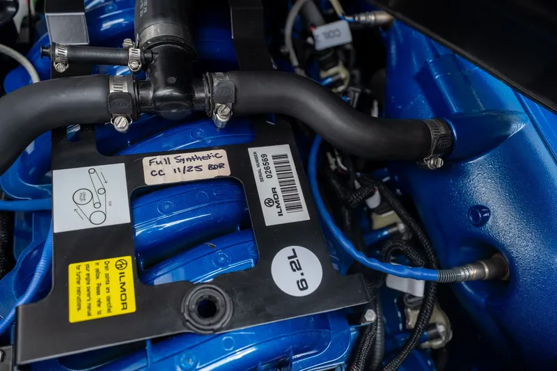 Slide: The Image of Engine of 2021 MasterCraft X24 boat, featuring Ilmor 6.2L components and full synthetic oil label. - 54