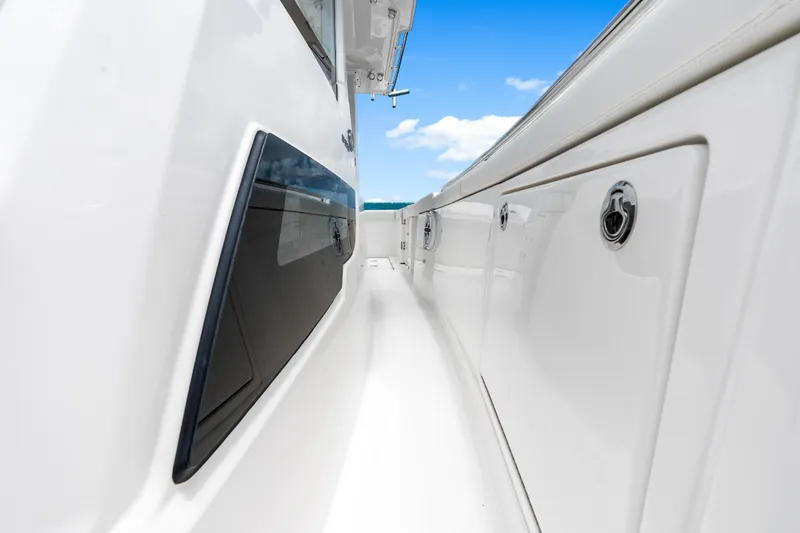 Slide: The Image of 2025 Pursuit S 328 Sport boat deck with sleek design and ocean view. - 18