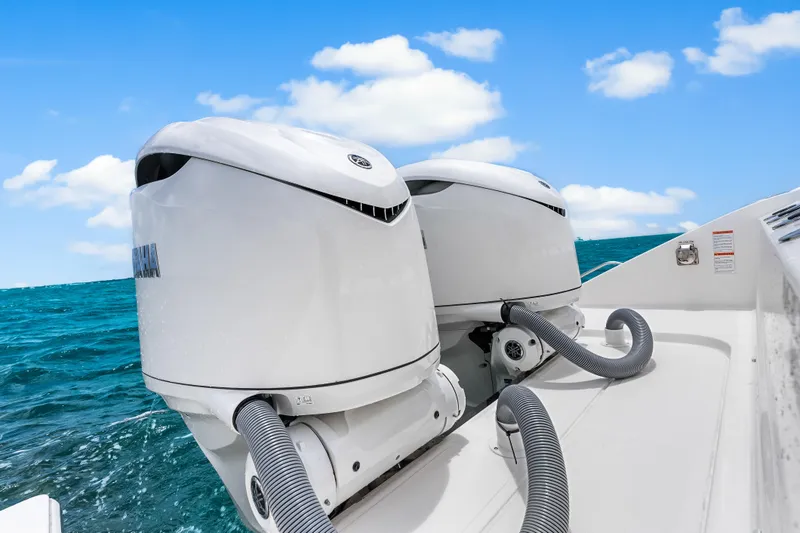Slide: The Image of 2025 Pursuit S 328 Sport boat with dual Yamaha outboard engines on open water. - 43