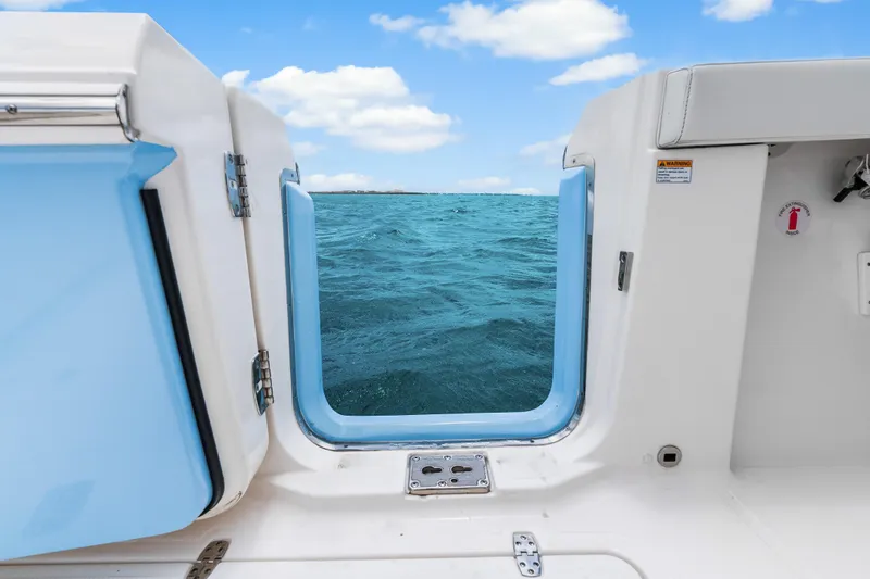 Slide: The Image of 2025 Pursuit S 328 Sport boat view of ocean through open door. - 35