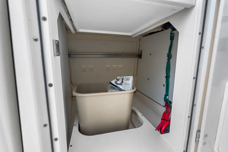 Slide: The Image of Storage compartment in 2025 Pursuit S 328 Sport boat with bin and accessories. - 48