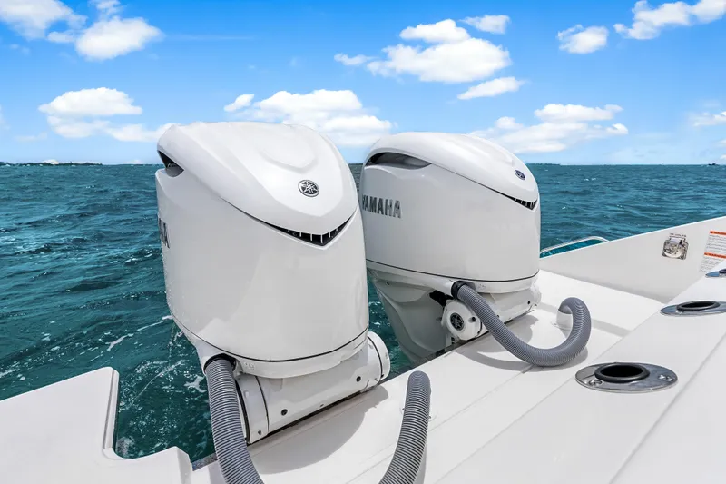 Slide: The Image of 2025 Pursuit S 328 Sport boat with dual Yamaha outboard motors on open water. - 40