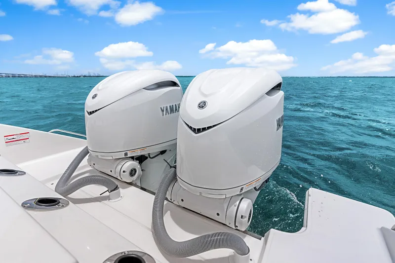 Slide: The Image of 2025 Pursuit S 328 Sport boat with dual Yamaha outboard engines on open water. - 41