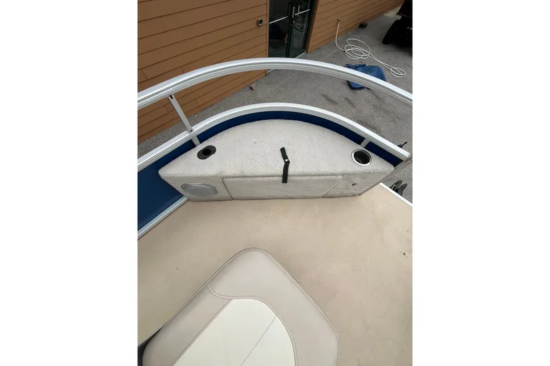 Slide: The Image of 2013 Godfrey 2286 FC boat interior with seating and cup holders. - 14