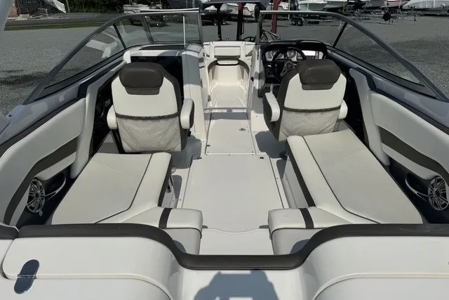 Slide: The Image of 2015 Yamaha Boats 242 Limited S interior with white seating and sleek design. - 3