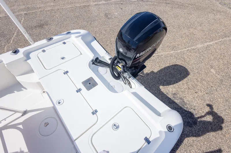 Slide: The Image of 2003 Triton 220 LTS boat with Mercury outboard motor, rear deck view. - 48