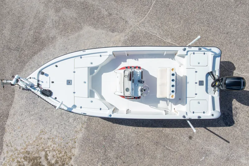 Slide: The Image of Overhead view of a 2003 Triton 220 LTS boat on a concrete surface. - 6