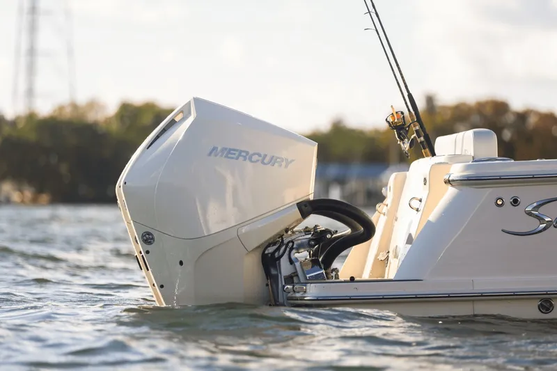 Slide: The Image of The image shows the rear of a 2027 Scout 260 LXF boat with a Mercury outboard motor. - 17