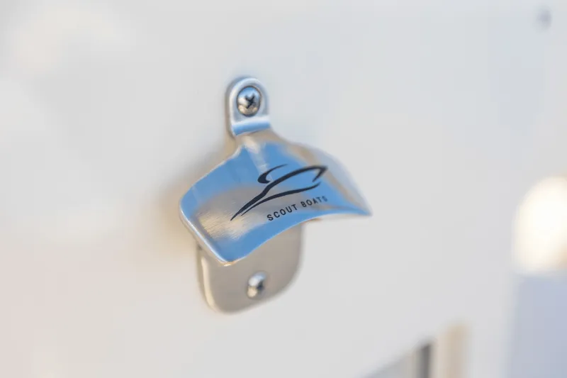 Slide: The Image of Bottle opener with Scout Boats logo on the 2027 Scout 260 LXF. - 33