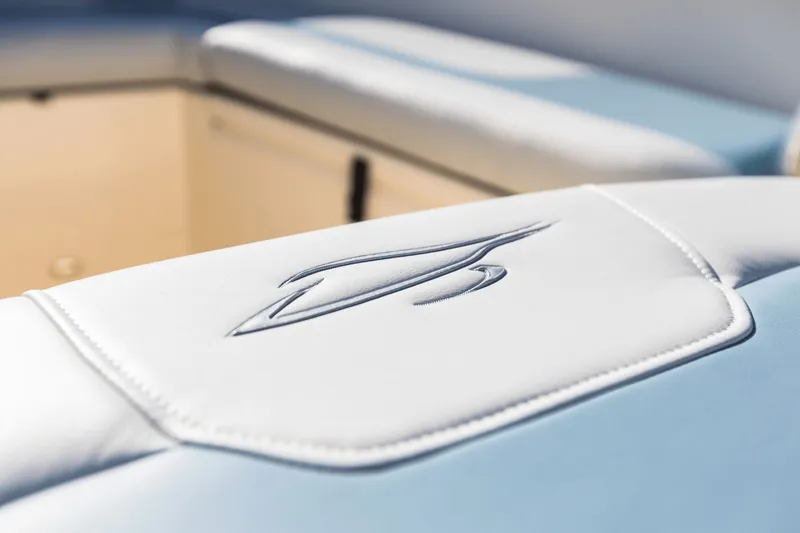 Slide: The Image of Close-up of upholstery with Scout logo on a 2027 Scout 260 LXF boat. - 20